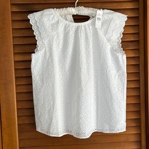 White eyelet loft top. NWT . Fully lined.